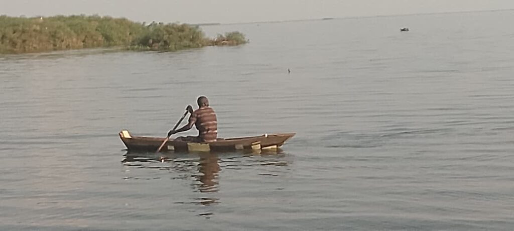 A fisherman inan illegal under sized fishing boat at Kayago on the shores of Lake Kyoga
